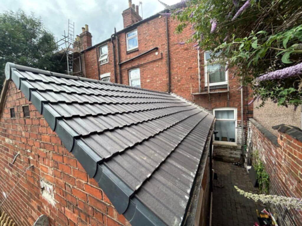 side view of a roof with a dry verge system installed.